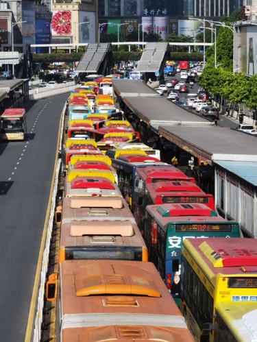 Breaking a harmful feedback loop: Mitigating bus queuing and headway irregularity on busy corridors